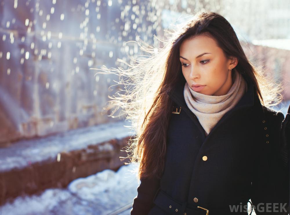 woman-walking-down-street-in-thought